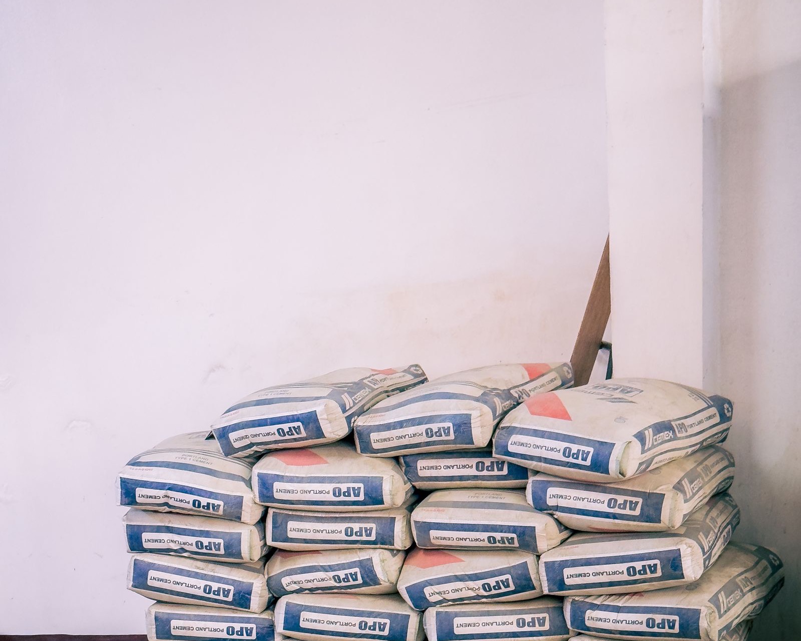 Stacked bags of ready-mix concrete on a site