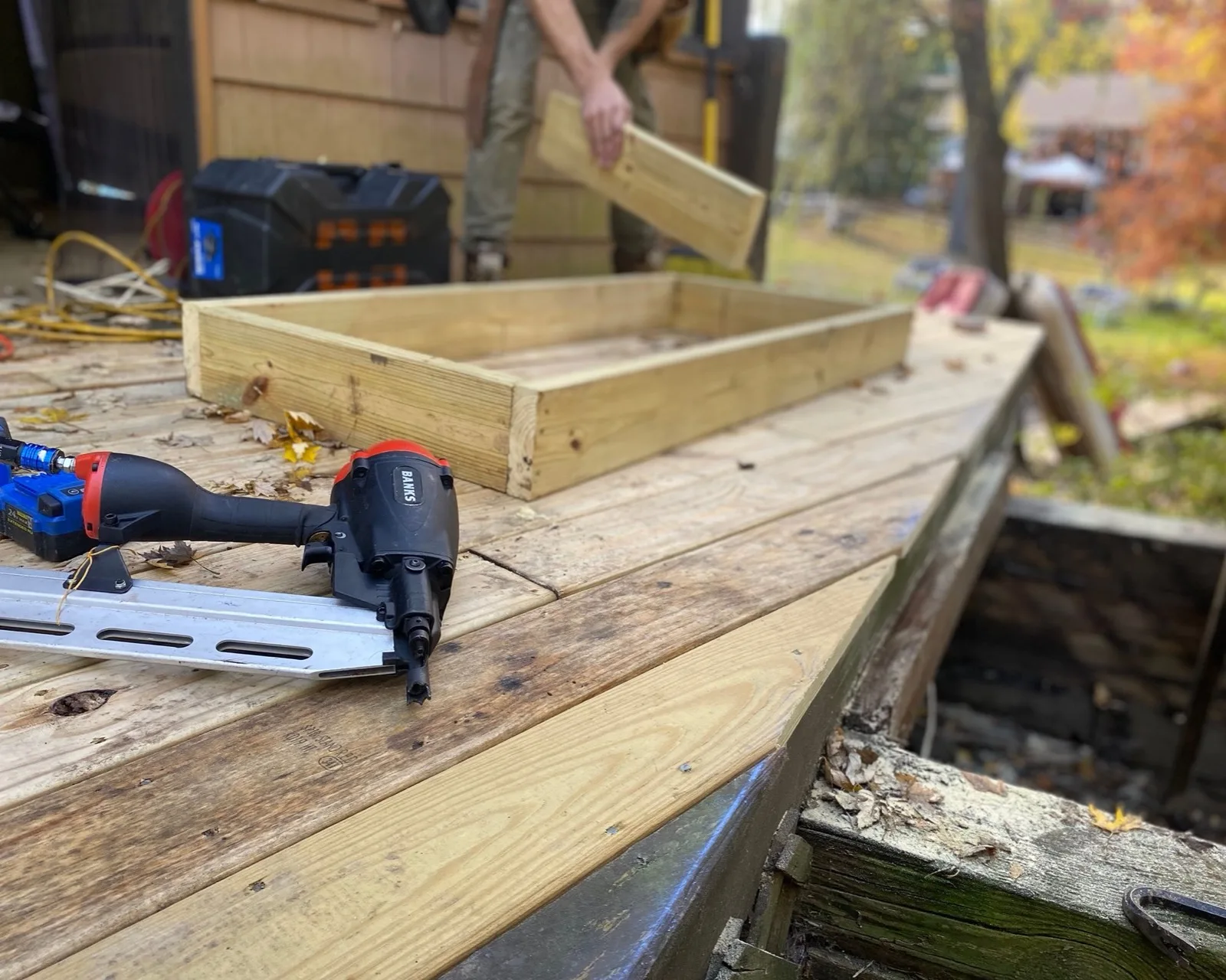 Deck boards being fixed down over the frame