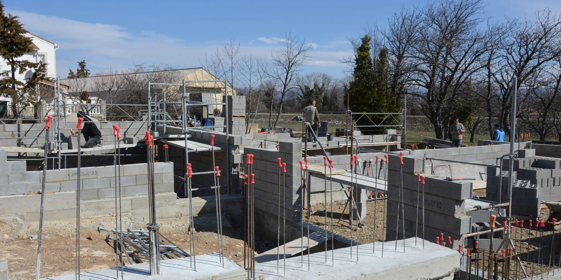 Strip footings and foundation walls formed on a house site