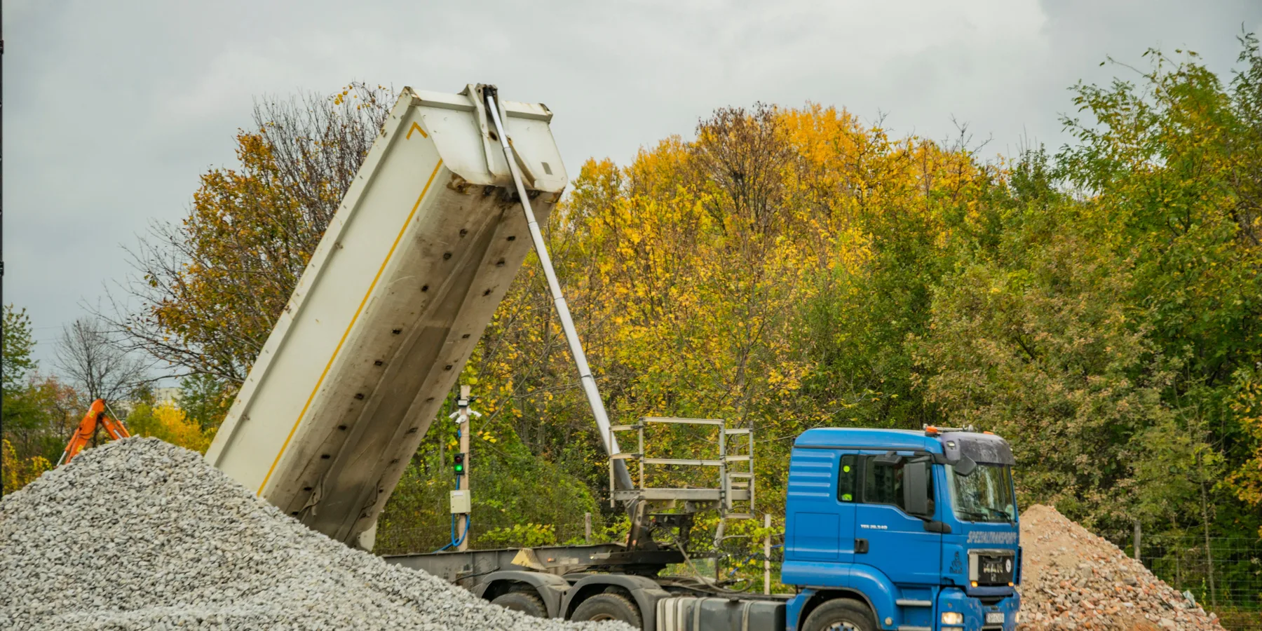 Shovel resting on a pile of gravel