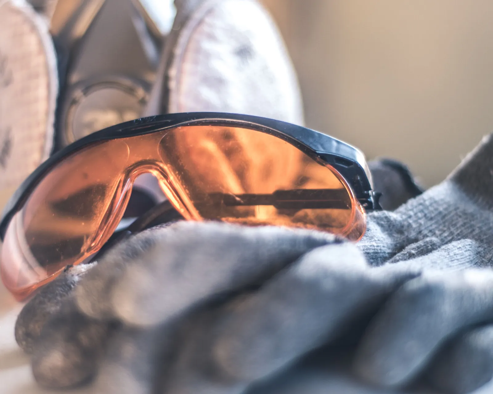 Safety glasses, a respirator and work gloves for handling insulation