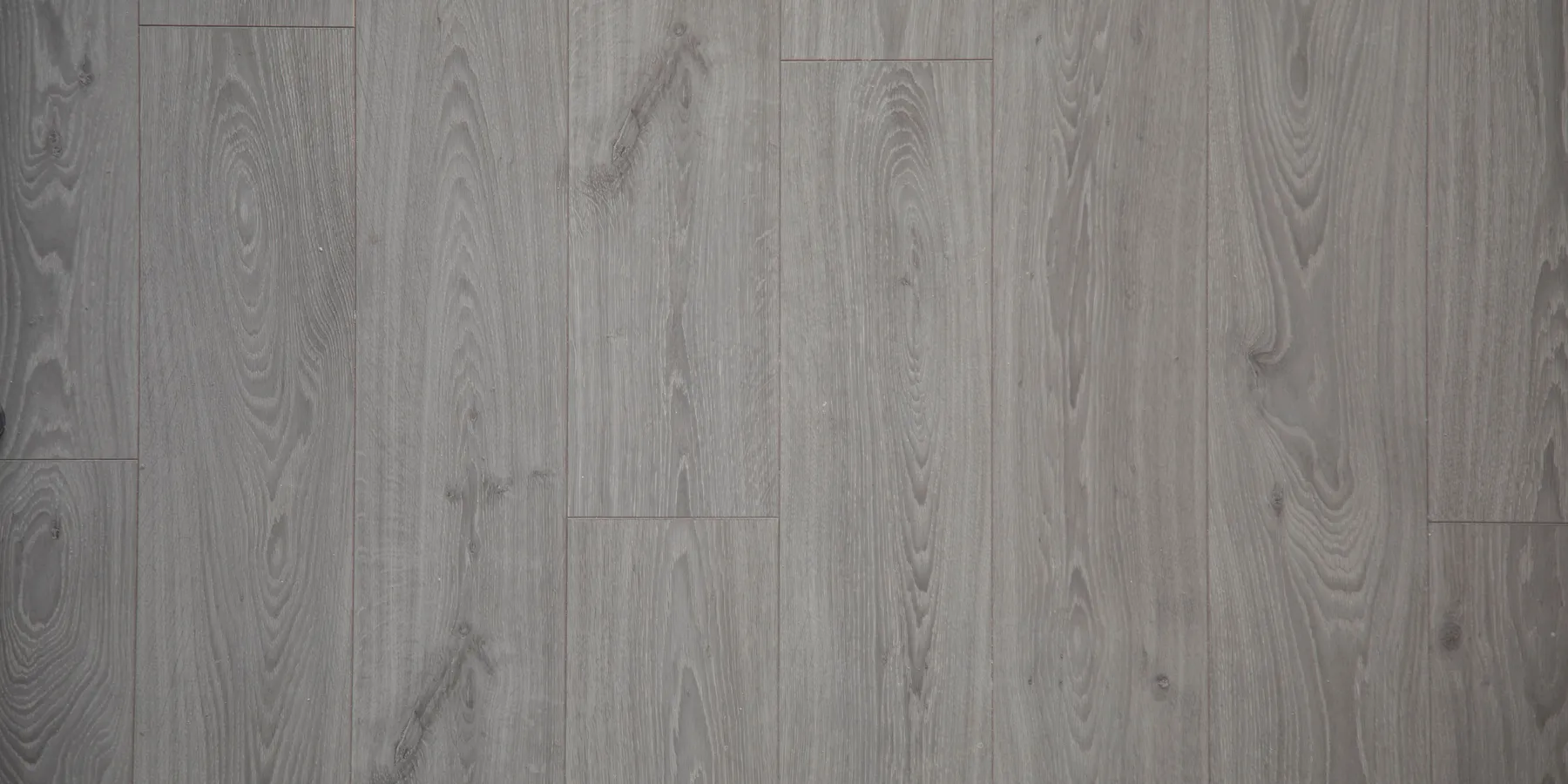 Grey wood-look floor planks seen from above