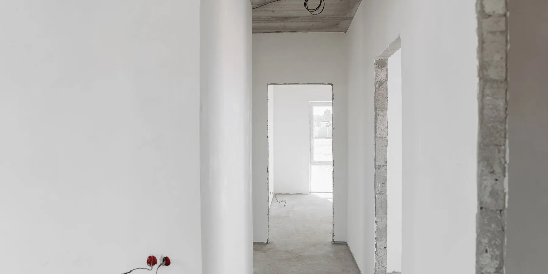 Freshly primed white walls in an unfinished interior