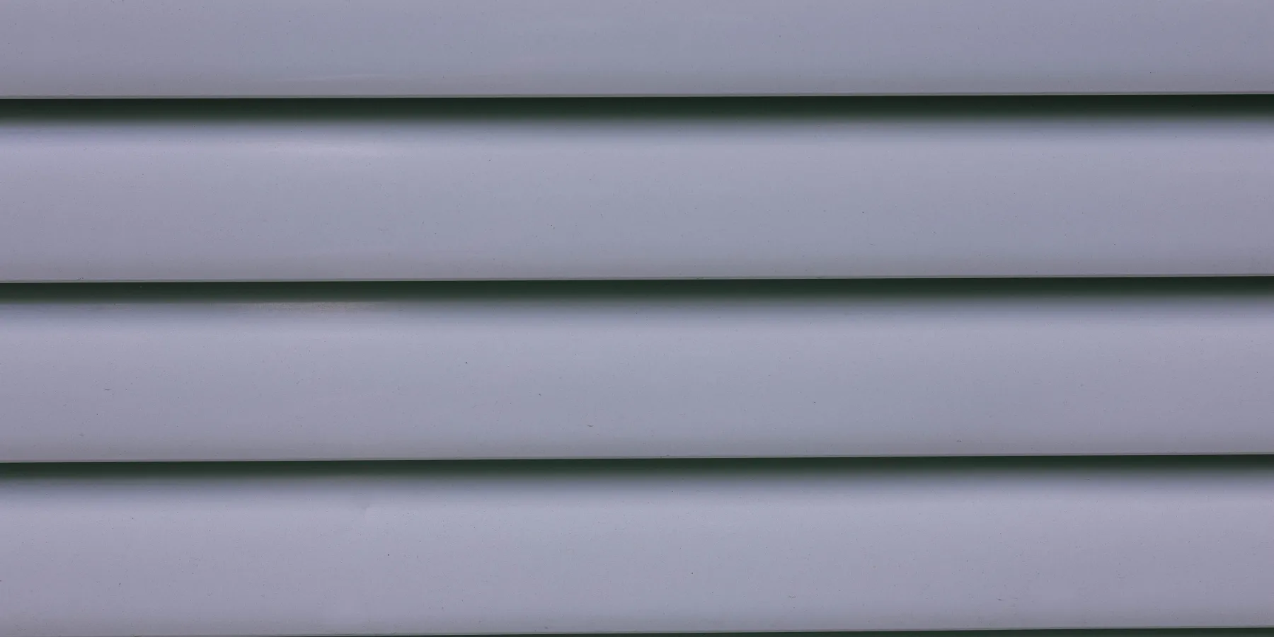 Close-up of gray horizontal vinyl siding panels